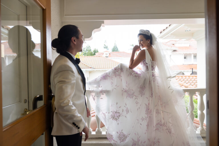 Bridal gown with pastel pink and purple floral embroidery, designed to complement a colorful Sofreh Aghd